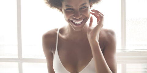 Woman smiling wearing bra