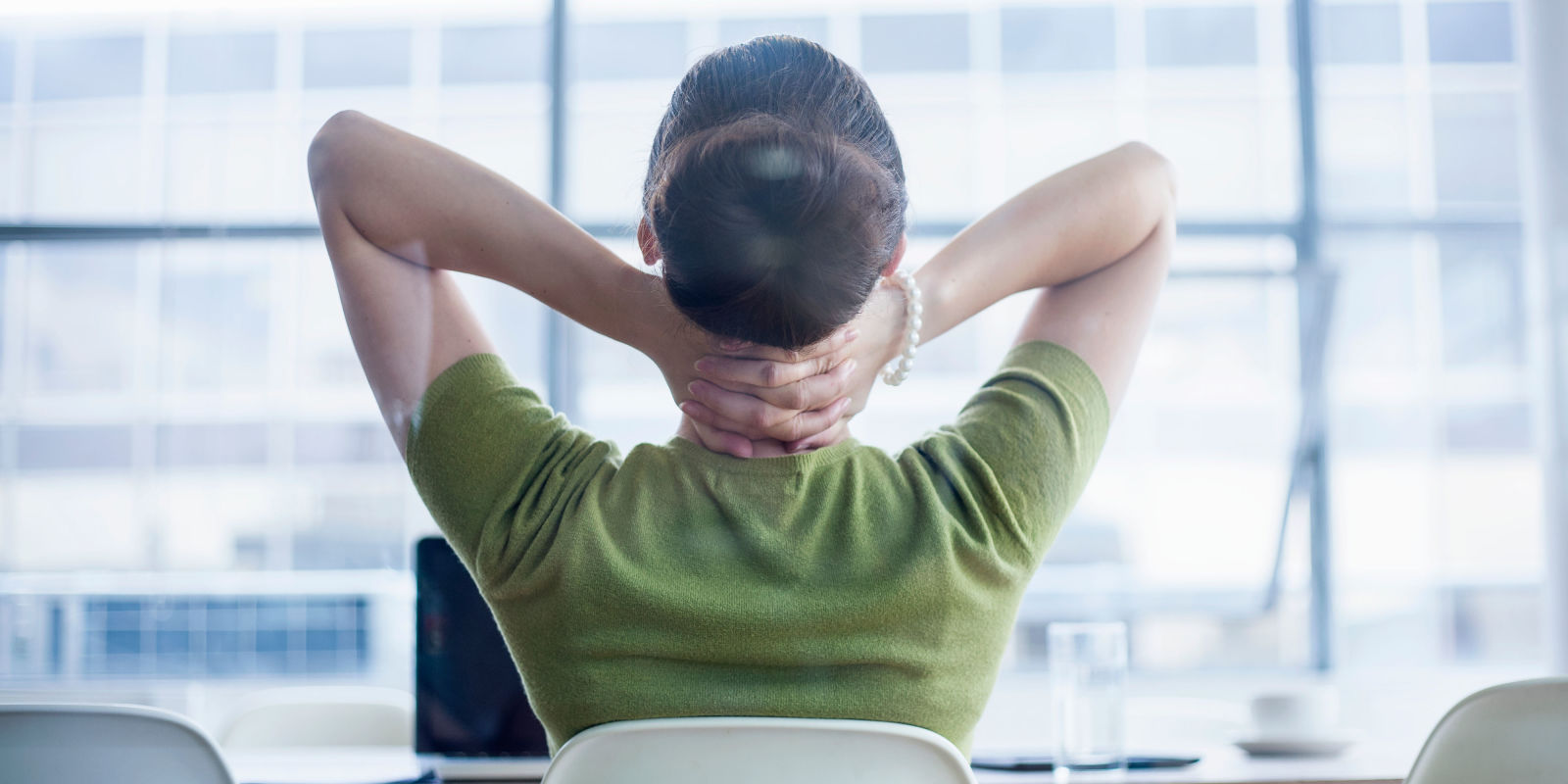 6 Myths About Knee Pain And Exercise Woman Sitting At Desk With Sore Neck
