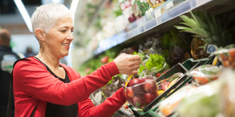 Mature woman shopping at supermarket